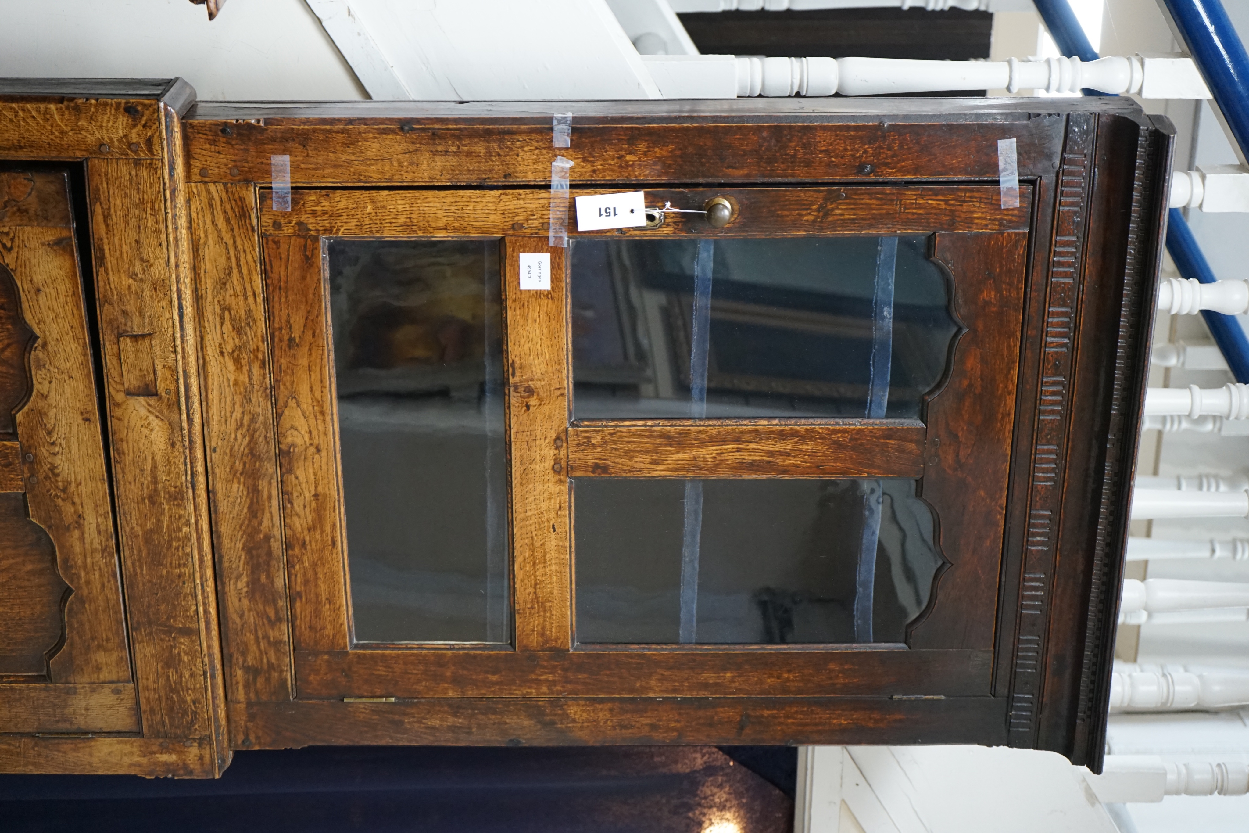 An 18th century two-sectional Provincial oak standing corner cupboard, width 80cm depth 30cm height 206cm